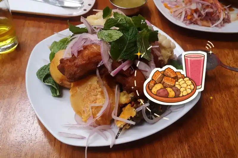 Cusco-style chicharrón with potatoes, mote corn and mint