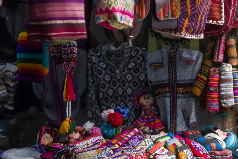 Handwoven Andean textiles at a market in Cusco